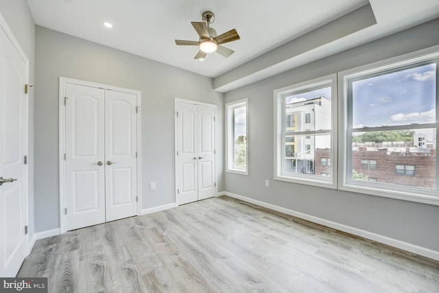 832 19th St NE Unit C, Washington, DC 20002 - unfurnished bedroom featuring two closets, wood finished floors, baseboards, recessed lighting, and ceiling fan