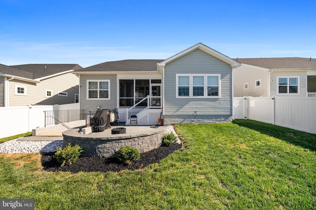 4387 Shakespeare Cir, White Plains, MD 20695 - rear view of property with a sunroom and an outdoor fire pit