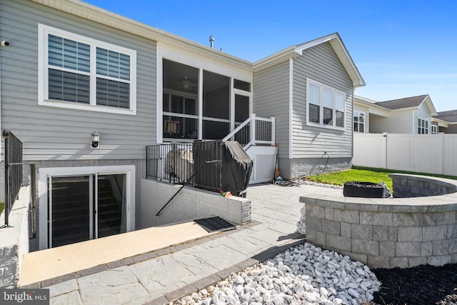 4387 Shakespeare Cir, White Plains, MD 20695 - back of property featuring a fire pit and a ceiling fan
