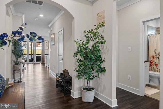 4387 Shakespeare Cir, White Plains, MD 20695 - hall with crown molding, dark wood-style flooring, baseboards, arched walkways, and recessed lighting