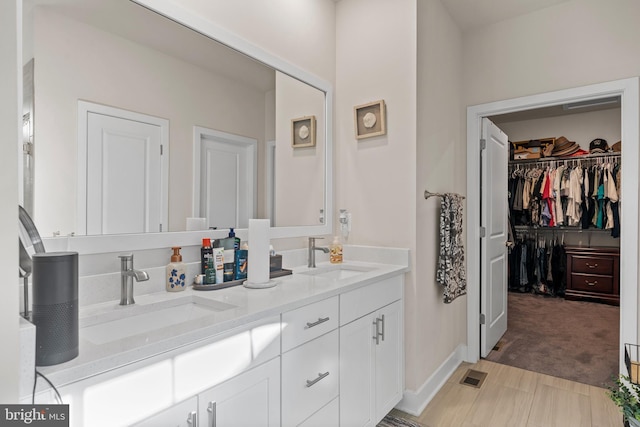 4387 Shakespeare Cir, White Plains, MD 20695 - full bath featuring double vanity, a spacious closet, and baseboards