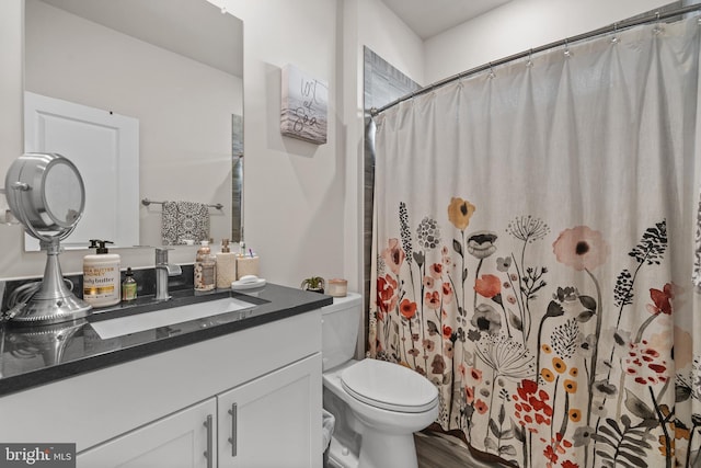 4387 Shakespeare Cir, White Plains, MD 20695 - full bathroom with toilet, vanity, curtained shower, and wood finished floors