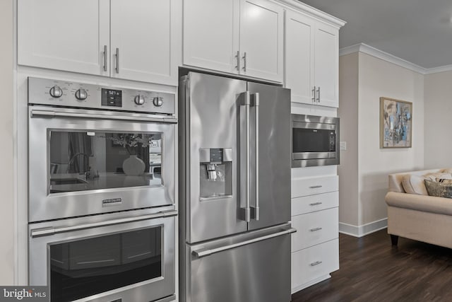 4387 Shakespeare Cir, White Plains, MD 20695 - kitchen with stainless steel appliances, baseboards, dark wood-style floors, white cabinets, and crown molding