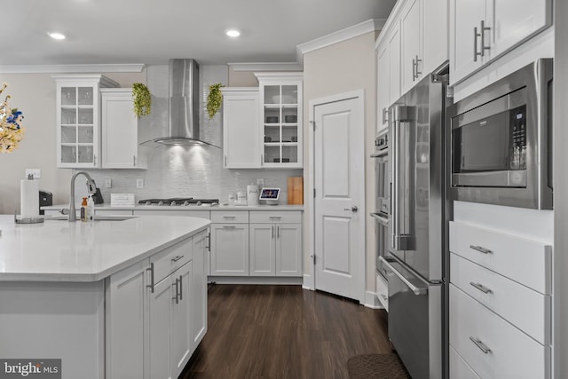 4387 Shakespeare Cir, White Plains, MD 20695 - kitchen with wall chimney exhaust hood, a sink, stainless steel appliances, white cabinets, and ornamental molding
