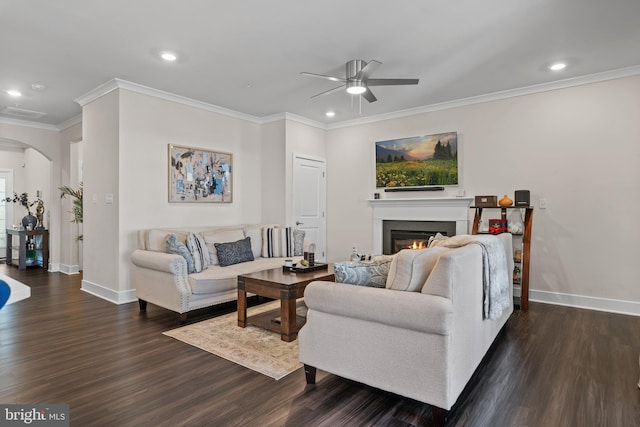 4387 Shakespeare Cir, White Plains, MD 20695 - living room with arched walkways, a ceiling fan, baseboards, ornamental molding, and dark wood-style floors