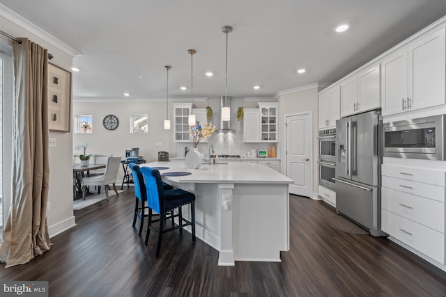 4387 Shakespeare Cir, White Plains, MD 20695 - kitchen featuring stainless steel appliances, ornamental molding, dark wood-type flooring, glass insert cabinets, and light countertops