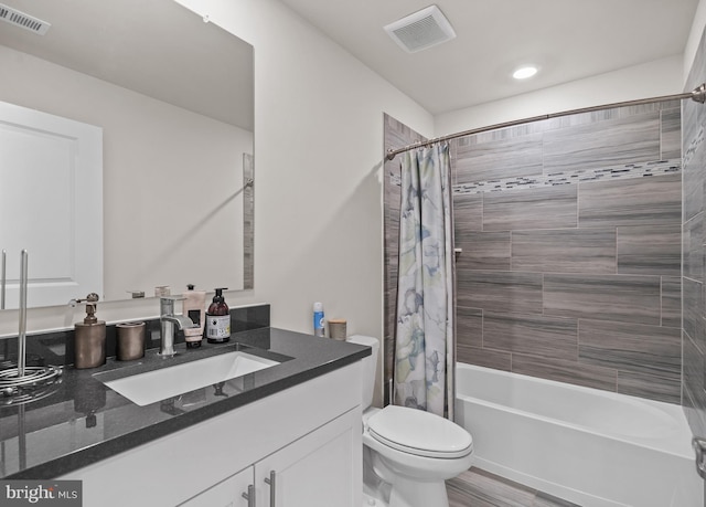 4387 Shakespeare Cir, White Plains, MD 20695 - bathroom with toilet, shower / bath combo with shower curtain, and vanity
