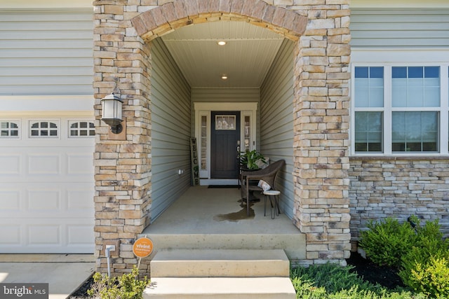 4387 Shakespeare Cir, White Plains, MD 20695 - entrance to property with a garage and stone siding