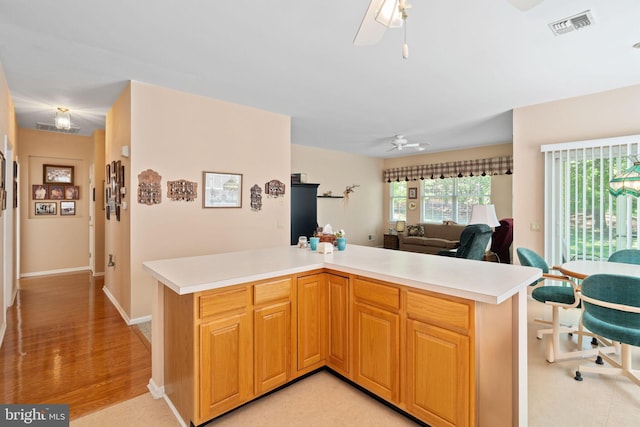 4 Forest Lake Ct, Barnegat, NJ 08005 - kitchen featuring ceiling fan, light countertops, open floor plan, and light wood-type flooring