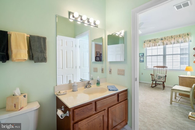 4 Forest Lake Ct, Barnegat, NJ 08005 - bathroom with toilet, vanity, a ceiling fan, and baseboards
