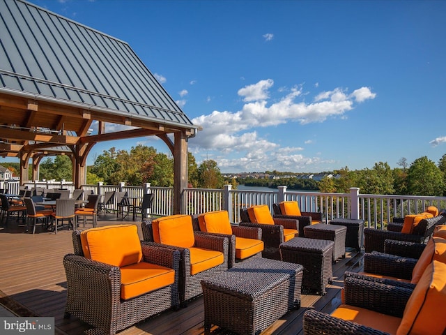 110 Fritillary Ct, Lake Frederick, VA 22630 - wooden deck featuring an outdoor hangout area, outdoor dining space, and a water view