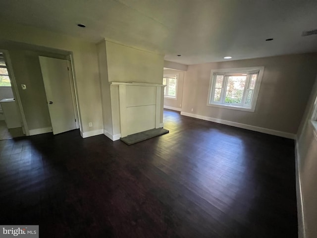 768 River Rd, Ewing, NJ 08628 - unfurnished living room with dark wood-type flooring, baseboards, and recessed lighting