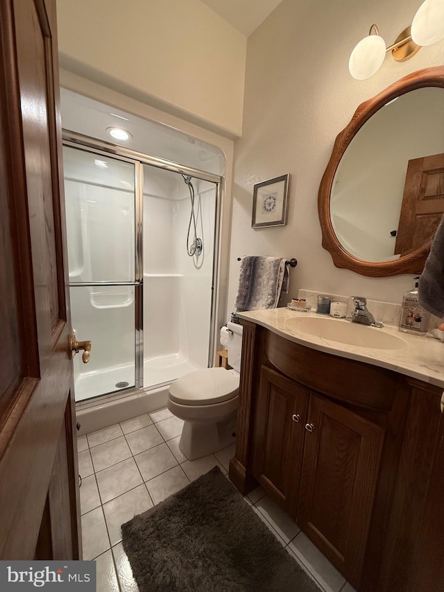 12534 Fawn Dr, Laurel, DE 19956 - full bathroom featuring vanity, a stall shower, and tile patterned flooring