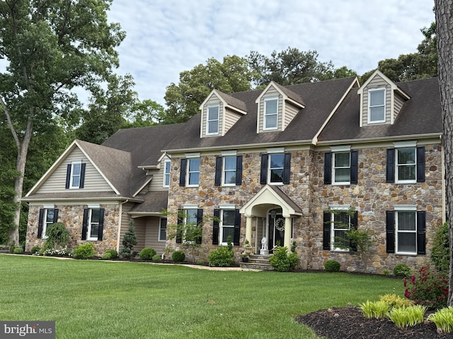 12534 Fawn Dr, Laurel, DE 19956 - view of front of home with stone siding, a front yard, and a shingled roof