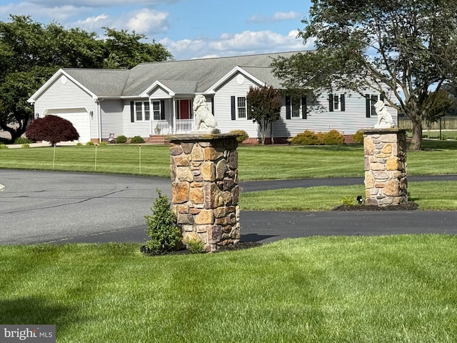 12534 Fawn Dr, Laurel, DE 19956 - ranch-style house with a front lawn, an attached garage, and a porch