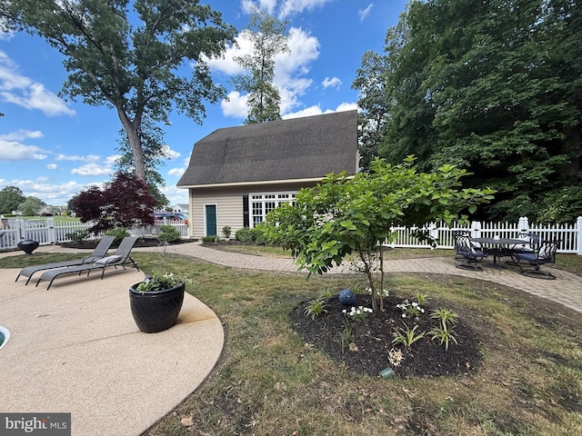 12534 Fawn Dr, Laurel, DE 19956 - view of home's exterior with a patio and a shingled roof