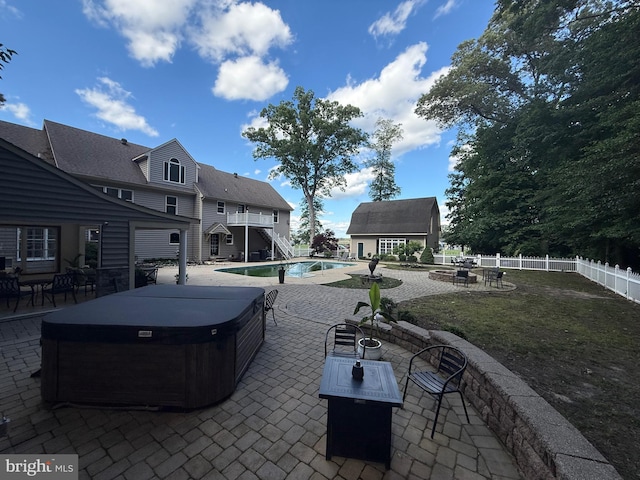 12534 Fawn Dr, Laurel, DE 19956 - fenced backyard with an outdoor fire pit, a hot tub, a patio area, and an outbuilding