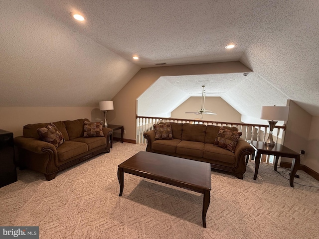 12534 Fawn Dr, Laurel, DE 19956 - living area with carpet floors, a textured ceiling, vaulted ceiling, and a ceiling fan