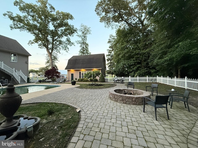 12534 Fawn Dr, Laurel, DE 19956 - view of patio featuring an outdoor fire pit, an outdoor structure, and an exterior structure