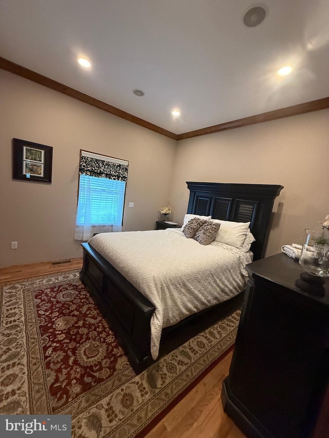12534 Fawn Dr, Laurel, DE 19956 - bedroom with light wood-type flooring, crown molding, and recessed lighting