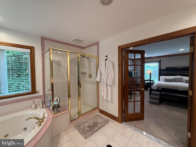 12534 Fawn Dr, Laurel, DE 19956 - ensuite bathroom with a stall shower, a jetted tub, tile patterned floors, and french doors