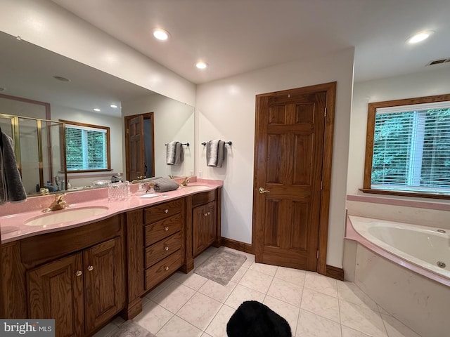 12534 Fawn Dr, Laurel, DE 19956 - full bathroom featuring a garden tub, double vanity, a shower stall, recessed lighting, and tile patterned floors