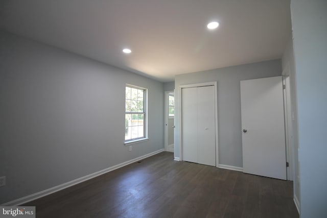 4713 Akron St, Temple Hills, MD 20748 - unfurnished bedroom with dark wood-type flooring, baseboards, recessed lighting, and a closet