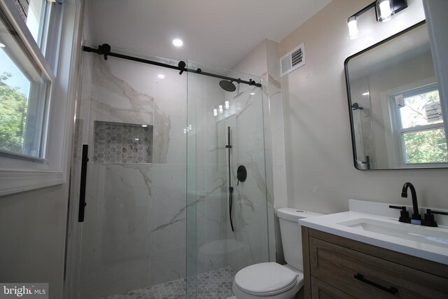 4713 Akron St, Temple Hills, MD 20748 - bathroom featuring toilet, a marble finish shower, and vanity