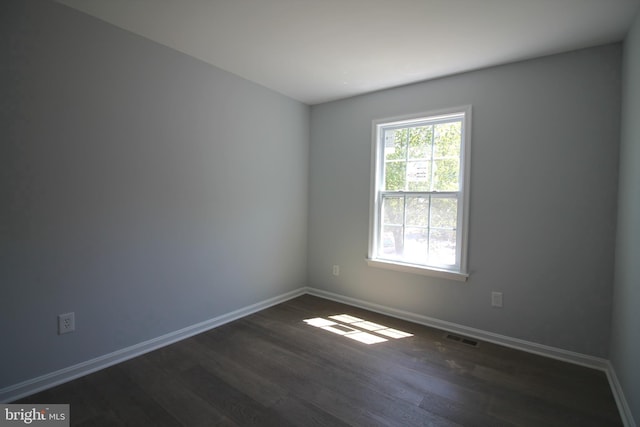 4713 Akron St, Temple Hills, MD 20748 - empty room with dark wood finished floors and baseboards