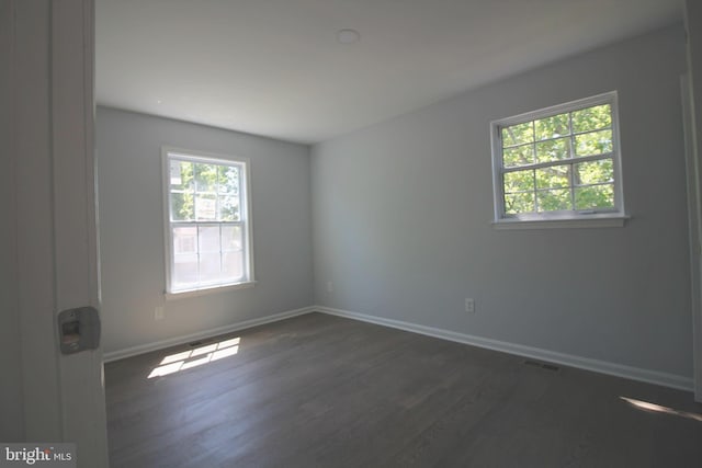 4713 Akron St, Temple Hills, MD 20748 - empty room with wood finished floors and baseboards