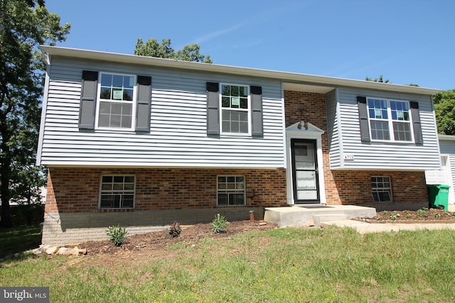 4713 Akron St, Temple Hills, MD 20748 - split foyer home featuring a front lawn and brick siding