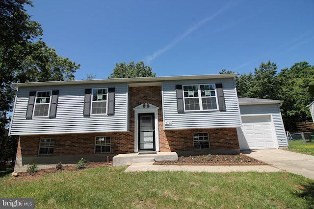 4713 Akron St, Temple Hills, MD 20748 - raised ranch featuring driveway, brick siding, and a front lawn