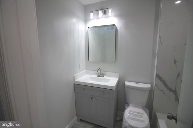 4713 Akron St, Temple Hills, MD 20748 - bathroom with vanity, toilet, marble finish floors, and baseboards