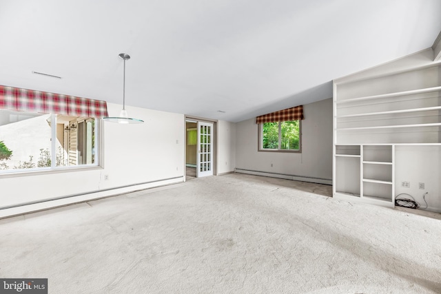 unfurnished living room featuring a baseboard radiator, carpet flooring, and lofted ceiling