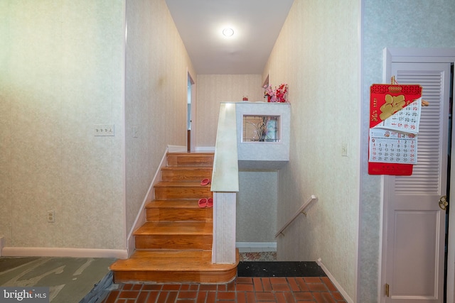 1200 Gainsboro Rd, Bala Cynwyd, PA 19004 - stairs featuring wallpapered walls, brick patterned flooring, and baseboards