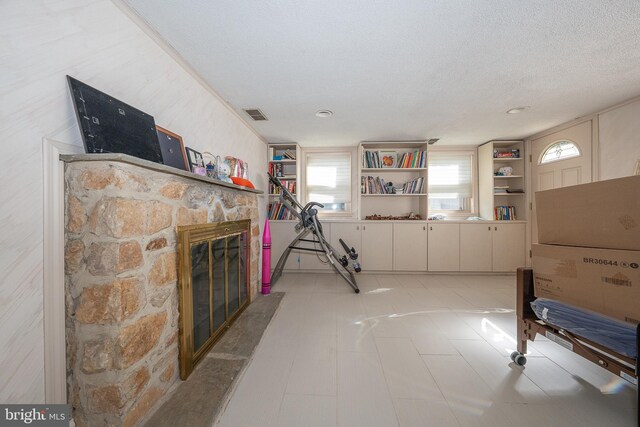 1200 Gainsboro Rd, Bala Cynwyd, PA 19004 - living room with a fireplace, built in features, and a textured ceiling