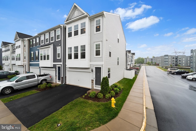18216 Summit Pointe Dr, Triangle, VA 22172 - view of front facade featuring a residential view, a garage, and asphalt driveway