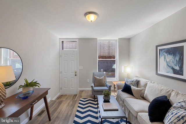 921 N Rose St, Baltimore, MD 21205 - living room with wood finished floors and baseboards