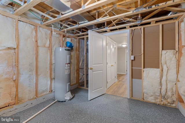 921 N Rose St, Baltimore, MD 21205 - unfinished below grade area featuring electric water heater