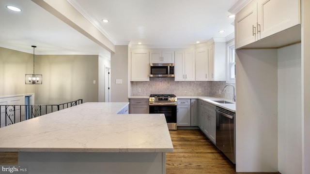 949 Marshall Dr, Warminster, PA 18974 - kitchen featuring appliances with stainless steel finishes, a sink, recessed lighting, wood finished floors, and a chandelier