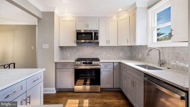 949 Marshall Dr, Warminster, PA 18974 - kitchen with appliances with stainless steel finishes, gray cabinets, a sink, ornamental molding, and dark wood finished floors