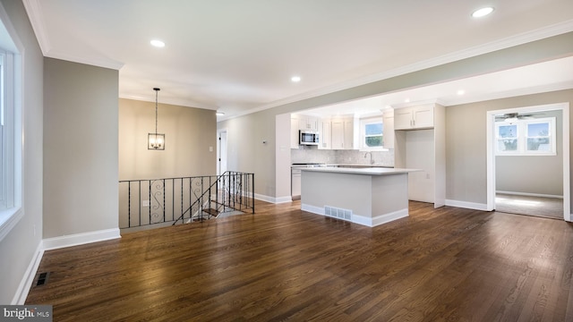949 Marshall Dr, Warminster, PA 18974 - unfurnished living room with dark wood-type flooring, a sink, ornamental molding, baseboards, and ceiling fan