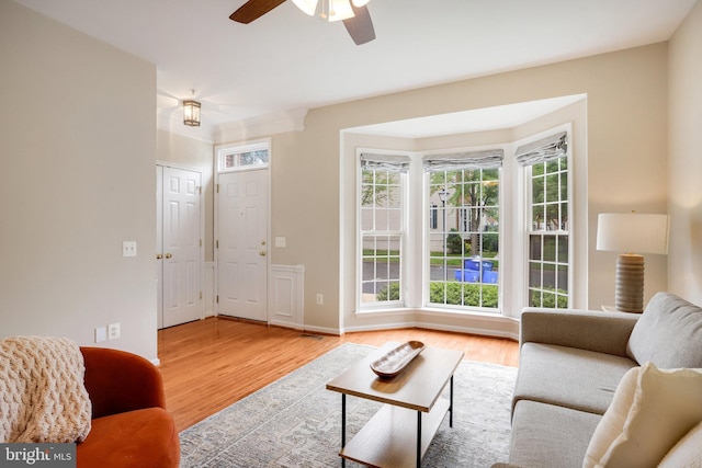 13943 Lullaby Rd, Germantown, MD 20874 - living area featuring wood finished floors, a ceiling fan, and baseboards