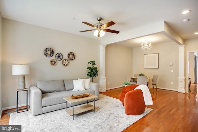 13943 Lullaby Rd, Germantown, MD 20874 - living area featuring ornate columns, ceiling fan, wood finished floors, recessed lighting, and baseboards