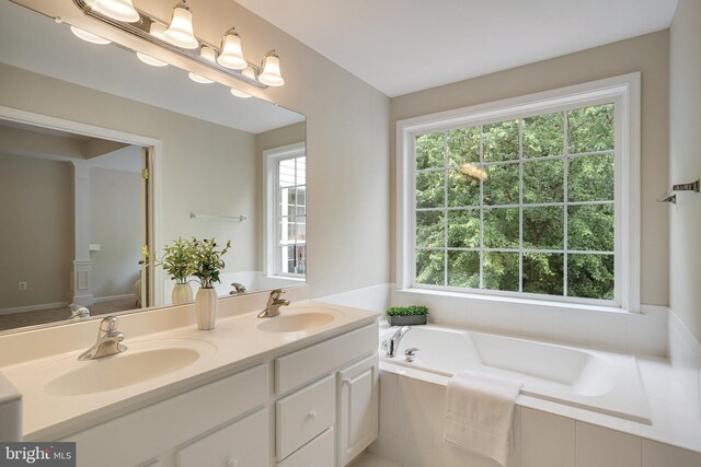 13943 Lullaby Rd, Germantown, MD 20874 - bathroom with double vanity and a garden tub