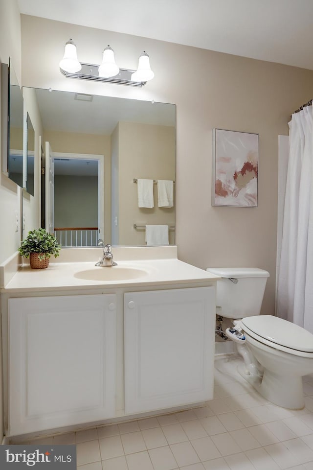13943 Lullaby Rd, Germantown, MD 20874 - bathroom with toilet, vanity, and tile patterned flooring