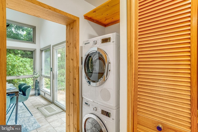 2005 S Quincy St, Arlington, VA 22204 - washroom featuring stacked washing machine and dryer and tile patterned flooring