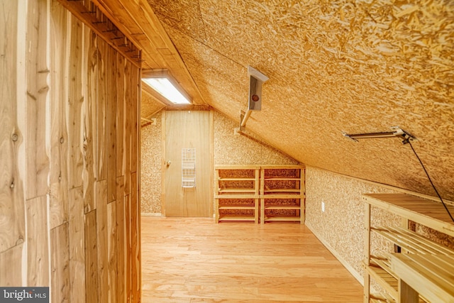 2005 S Quincy St, Arlington, VA 22204 - additional living space with vaulted ceiling, wood finished floors, and wallpapered walls