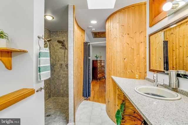 2005 S Quincy St, Arlington, VA 22204 - bathroom with a tile shower, vanity, and tile patterned floors