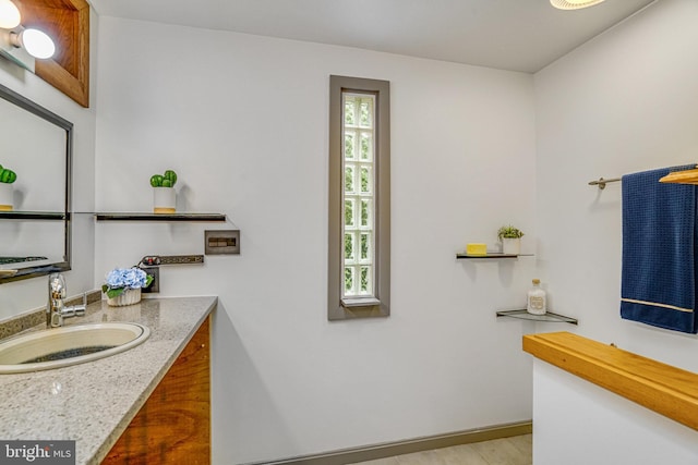 2005 S Quincy St, Arlington, VA 22204 - bathroom featuring vanity, wood finished floors, and baseboards